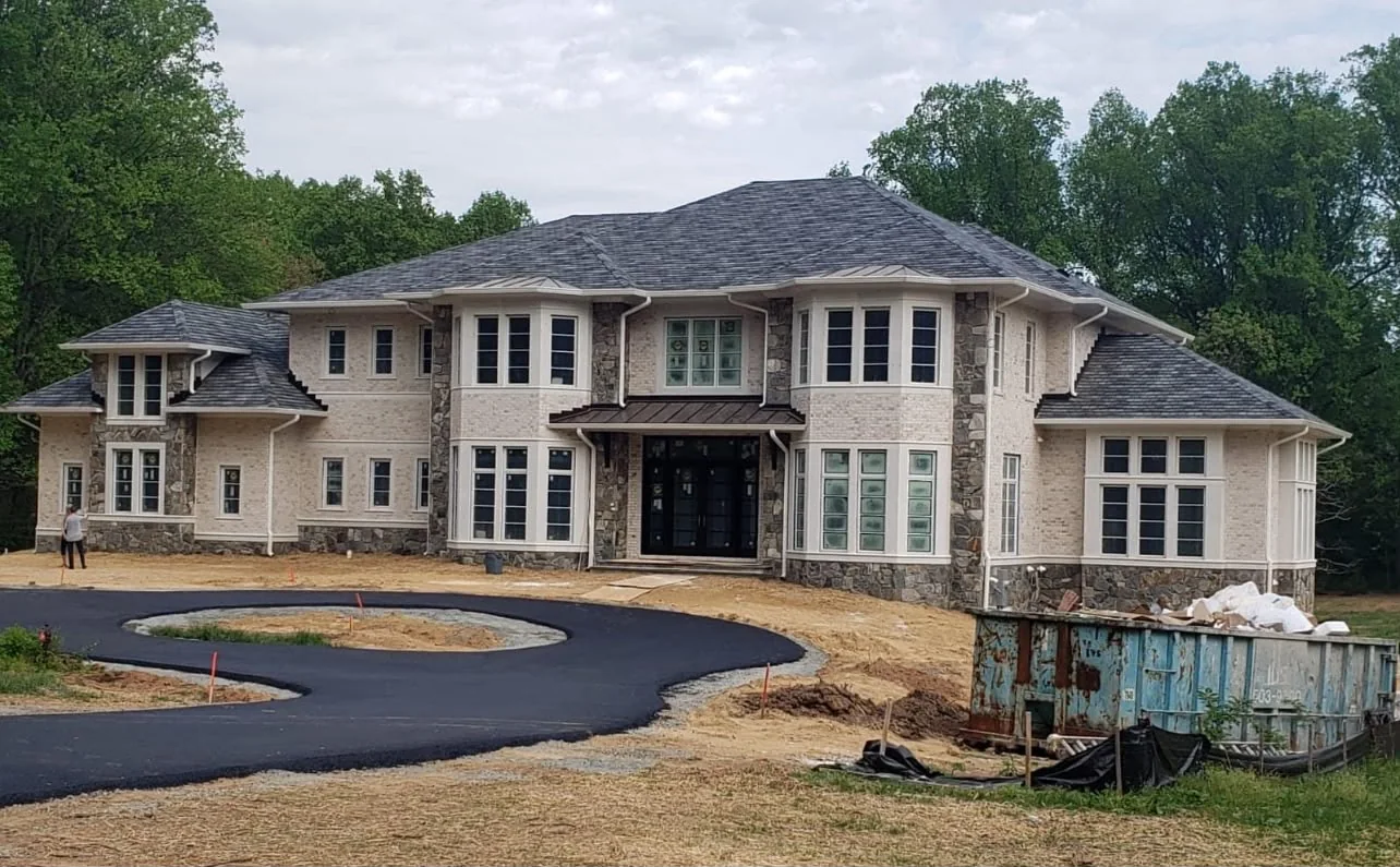 Luxury home with brick and stone masonry