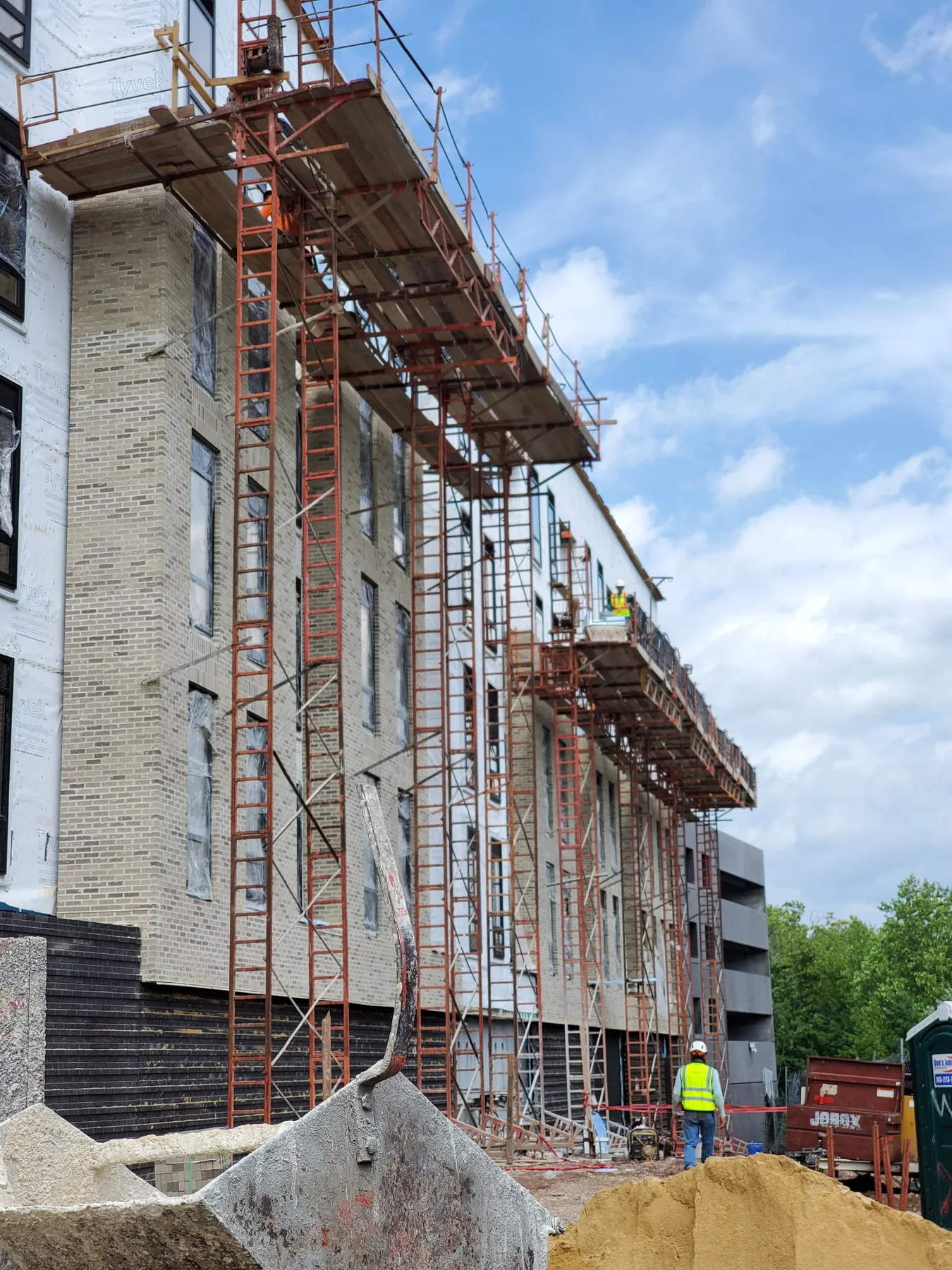 Large masonry project with scaffolding and brick installation